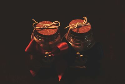 Close-up of red candle on white background