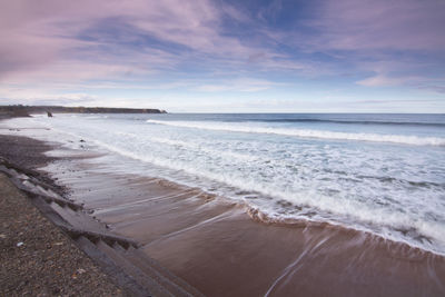 Scenic view of beach against sky
