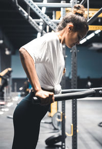 Rear view of man exercising in gym