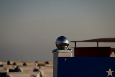 Close-up of fence post holder against clear sky