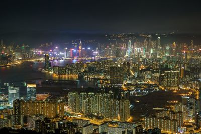 High angle view of illuminated city buildings at night