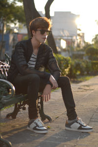 Young man sitting outdoors