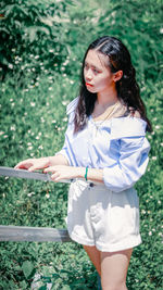 Full length of woman standing on field