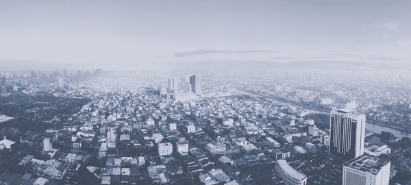 Aerial view of cityscape against sky