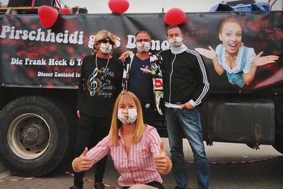 High angle portrait of people standing on bus