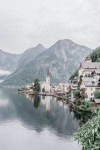 Panoramic view of buildings and mountains against sky