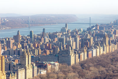 High angle view of city buildings against sky