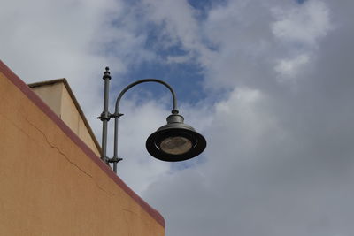 Low angle view of street light against sky