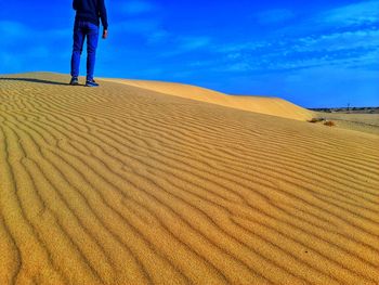Waves in sand dunes on desert sahara of algeria