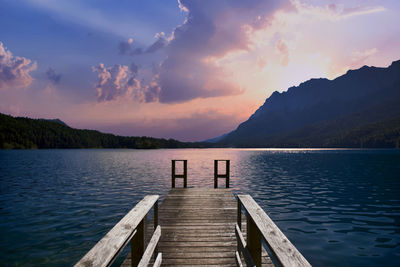 Pier over lake against sky