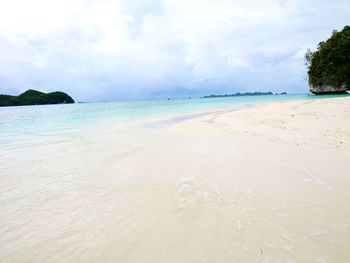 Scenic view of beach against sky