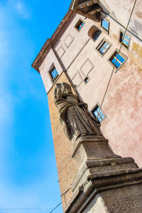 Low angle view of building against blue sky