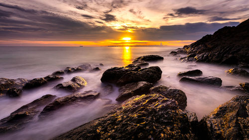 Scenic view of sea against sky during sunset