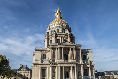 The beautiful facade and the golden dome of the invalides in paris
