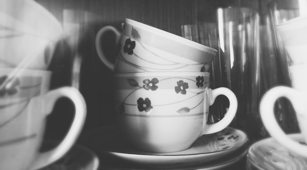 CLOSE-UP OF COFFEE CUP ON TABLE WITH SPOON