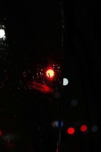 Close-up of illuminated car window