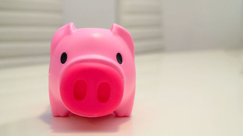 Close-up of piggy bank on table