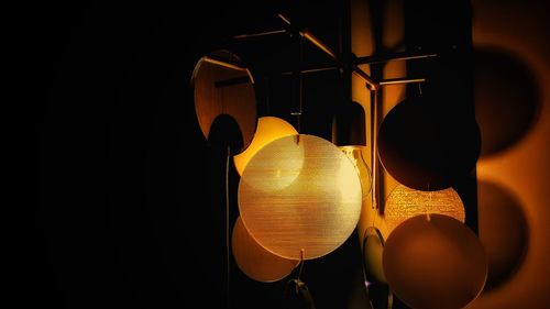 Low angle view of illuminated lighting equipment