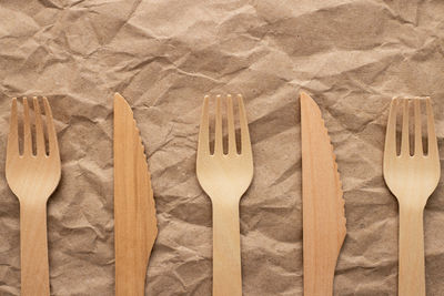 High angle view of wooden spoons on table