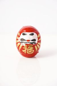 Close-up of red ball against white background