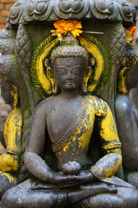 Close-up of buddha statue in temple