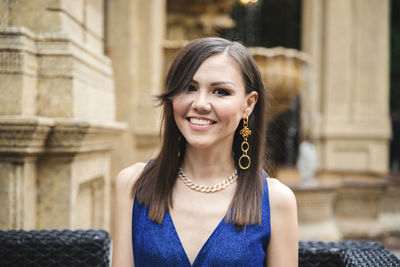 Portrait of young woman standing outdoors