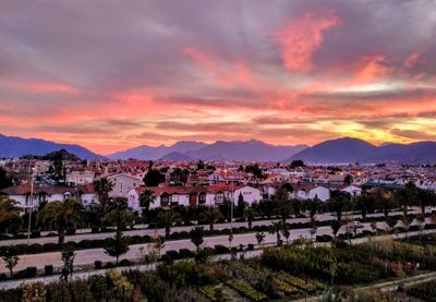 Townscape against sky during sunset