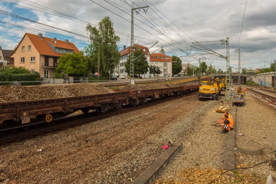 Train on railroad tracks against sky