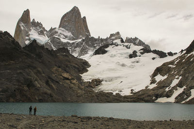 Scenic view of sea and snowcapped mountains against sky, lake and glacier