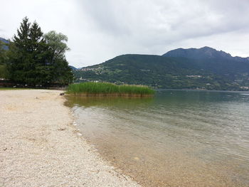 Scenic view of mountains against cloudy sky