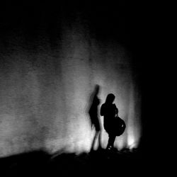 Close-up of woman in dark room