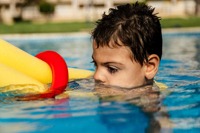 Portrait of boy in swimming pool