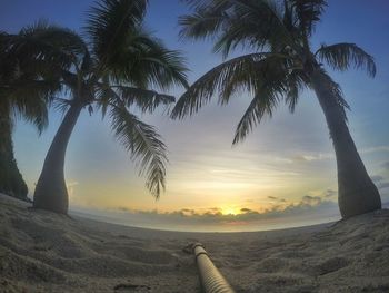 Scenic view of beach against sky during sunset