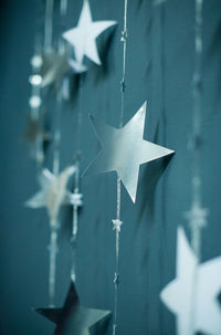 Close-up of paper hanging against wall