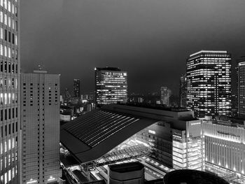 Modern buildings in city against clear sky