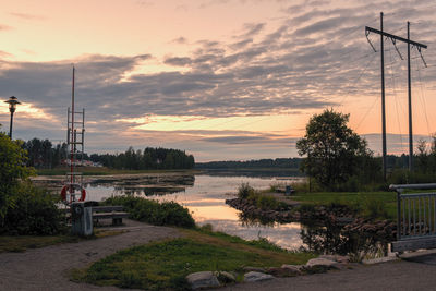 Scenic view of lake against sky during sunset