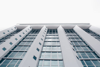 Directly below shot of building against clear sky