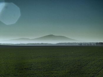 Scenic view of field against sky