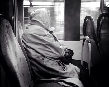 Side view of a woman traveling in bus