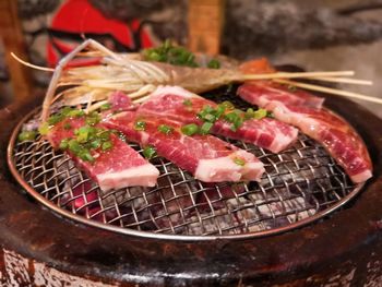 High angle view of meat on barbecue grill