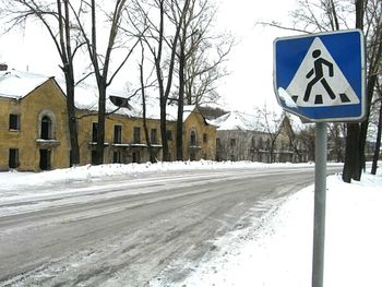 Road passing through snow covered landscape