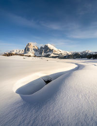 Scenic view of snowcapped mountain against sky