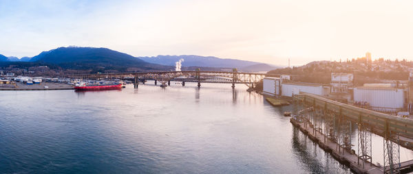 Panoramic view of river and city against sky