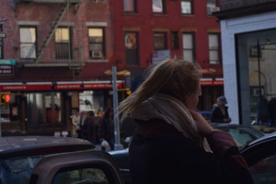 Rear view of woman in bus