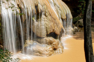 View of waterfall along rocks