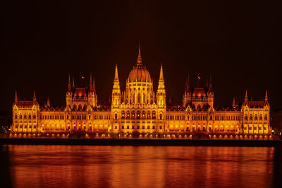 Illuminated hungarian parliment lit up at night in budapest 
