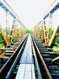 Railroad tracks amidst bridge