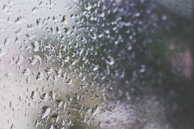 Close-up of wet window during rainy season