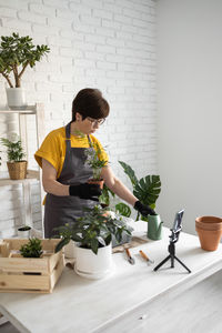 Portrait of boy playing with vegetables on table