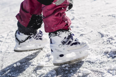 Close-up of feet in ice skates